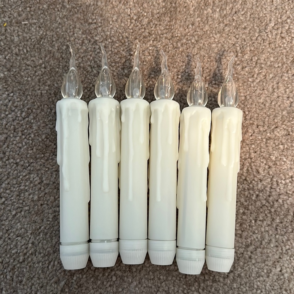 Tapered candles, battery-operated. New in box. Batteries not included.